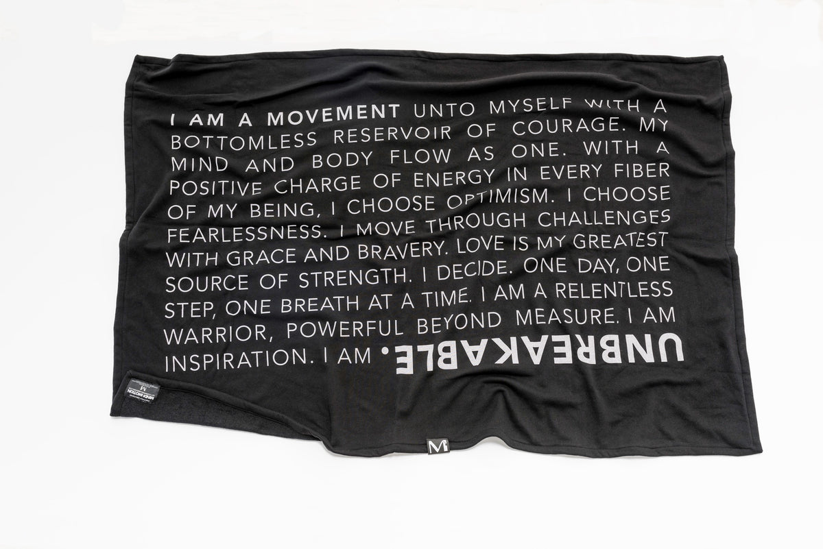 Extra soft, polycotton blended fleece blanket with UNBREAKABLE manifesto. Black.